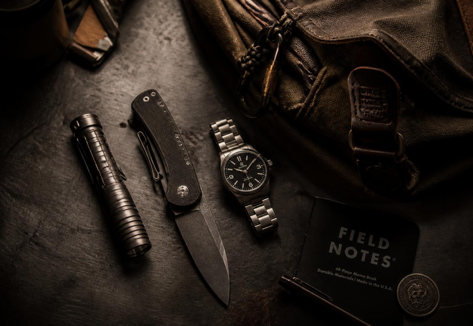 Field-tested everyday carry gear laid out on a steel workbench